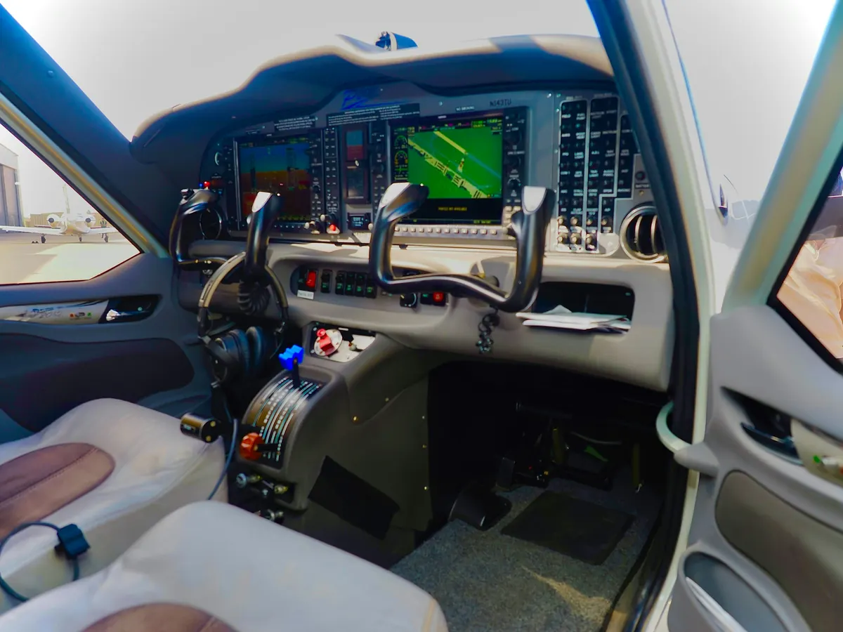 Flight deck with control yokes and glass displays